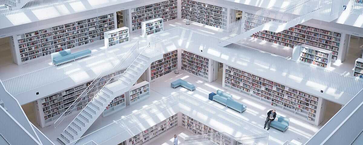 Large library with white floors and bookshelfs.